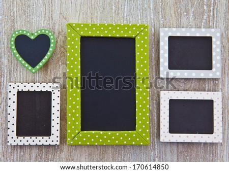 Wooden background with various little chalkboards with copy space