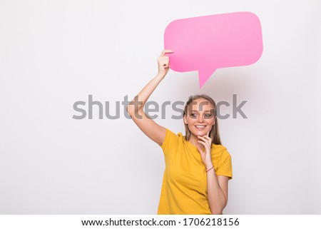 Young beautiful girl holding a pink bubble for text, isolated on white background