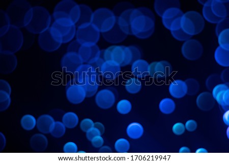 Glowing colored blurred dots. Colored fantasies. Bokeh. Abstract colored background. Glowing fiber optic filaments.