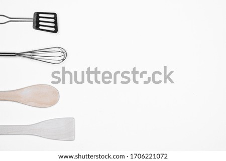 Stainless steel kitchen utensils isolated on white background. For copy space.