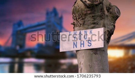 Thank you NHS sign with London sunset city blurred background during coronavirus pandemic in the UK