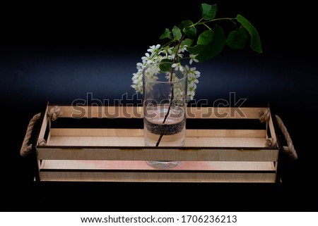 A transparent glass on a wood box