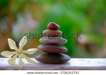 zen stones and white flower