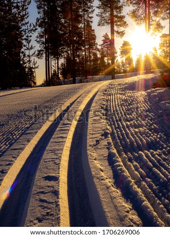 Skiing track in the early morning, at sunrise.