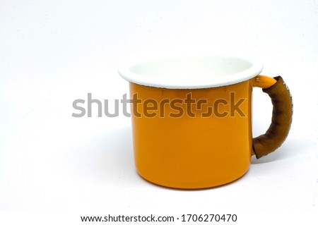 Yellow Enamel Mug on White Background