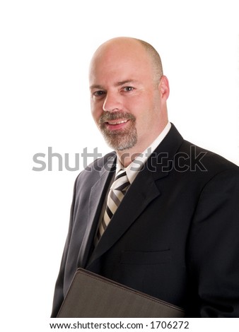 Stock photo of a well dressed businessman holding a notebook, isolated on white.
