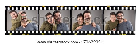 Happy father and son images on old fashioned 35mm filmstrip isolated on white background. Brand name Fura Raji is not real, created by myself. 