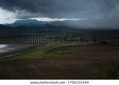 Wonderful view of the rain clouds over the mountains. Dramatic and picturesque scene. Location place Klimentyev Mountain, Crimea, Ukraine, Europe. Artistic picture. Beauty world.