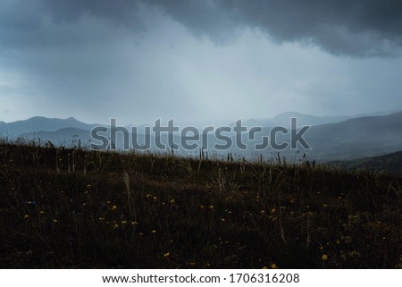 Wonderful view of the rain clouds over the mountains. Dramatic and picturesque scene. Location place Klimentyev Mountain, Crimea, Ukraine, Europe. Artistic picture. Beauty world.
