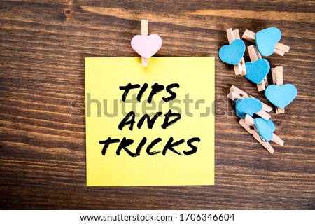 Tips and tricks concept. Dating, relationships. love and family. Wooden clips with heart and note on wooden table
