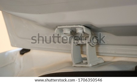 Close up of the car trunk door hinge Royalty-Free Stock Photo #1706350546