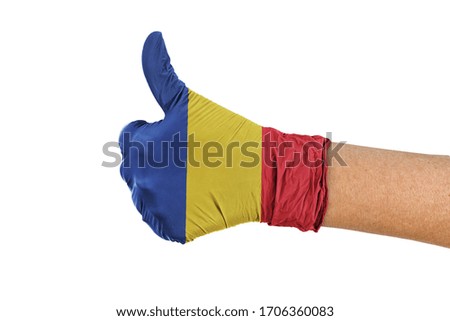 Romania flag on a medical glove showing thumbs up sign