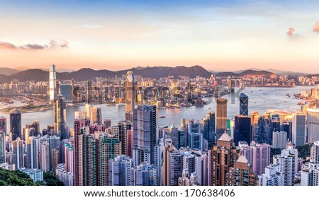 Sunset over Victoria Harbor as viewed atop Victoria Peak Royalty-Free Stock Photo #170638406