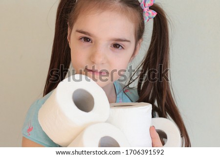 Funny girl with a stock of toilet paper photo fun