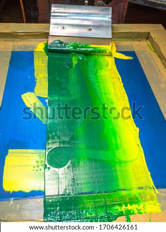blend color in green tone by dark green light green and yellow then stir with handle printer
