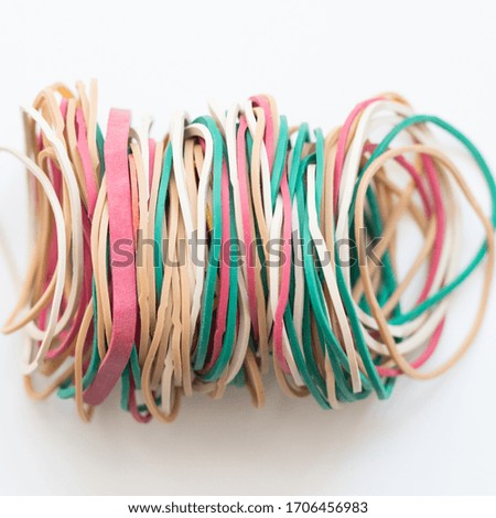 Closeup colored rubber bands isolated on white background
