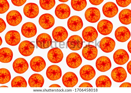 a beautiful image of an interesting pattern of tomatoes of the pachino variety, against a bright white background, flatlay