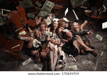 Beautiful women  in the rain of money