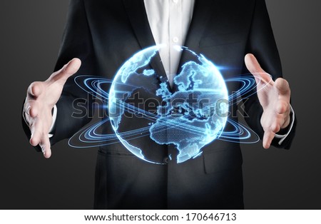 Businessman holding holographic globe