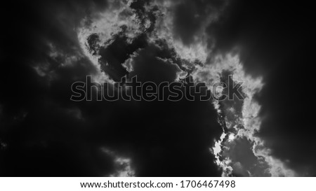 Black and white picture of clouds floating in the sky