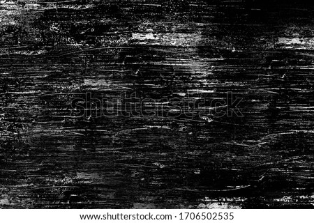 The scratched surface of the wall is black.Background or texture