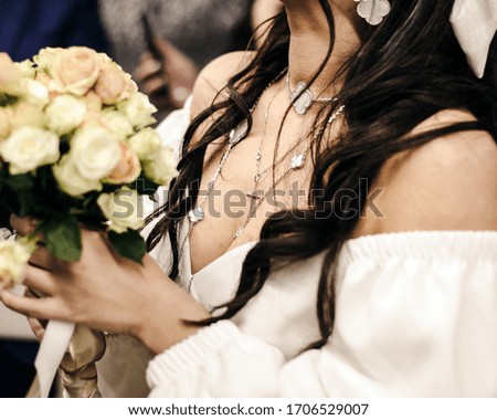 A bouquet of flowers in the hands of the bride on holiday. Wedding is an important event in people's lives. Selective focus.