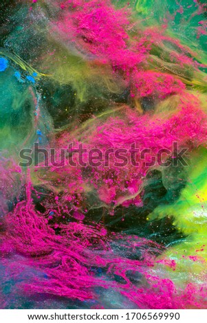 Abstract background with natural texture of colorful splashes. Expressive swirls of color mixing.