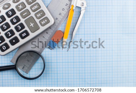 Mathematics geometry tool for student in math class with copy space for text on paper graph background. Mathematics concept