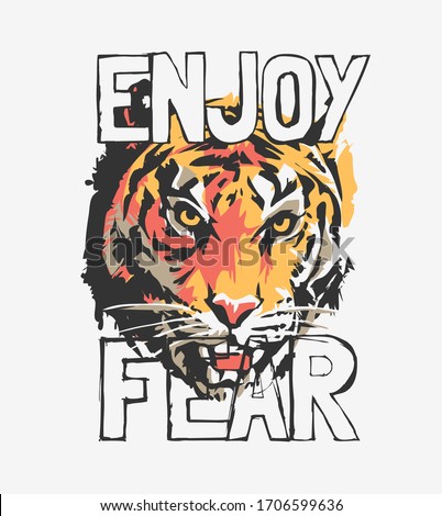 enjoy fear slogan with tiger face graphic illustration