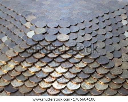 the pyramid is made of metal coins russian rubles as an illustration of the stability of the currency