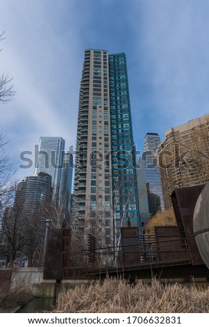 Day time exterior establishing shot of high rise luxury apartment building on Toronto skyline waterfront