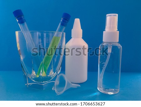 set of containers for the manufacture of disinfectants yourself, a container with a dispenser. hydrogen peroxide and funnel for mixing liquids