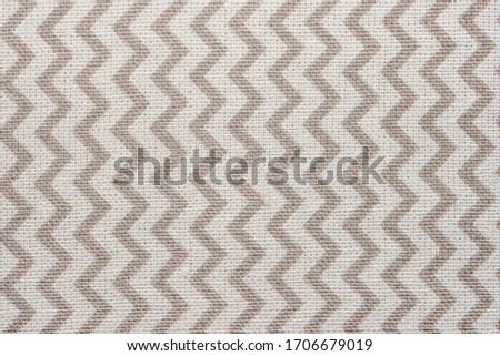 Pattern of gray and white striped zig zag. Macro textile texture Royalty-Free Stock Photo #1706679019