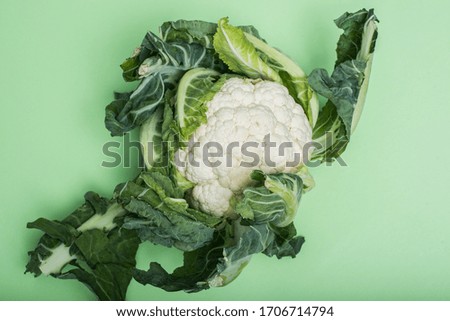 Natural cauliflower on green background