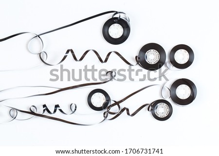 Tangled audio tape on white background
