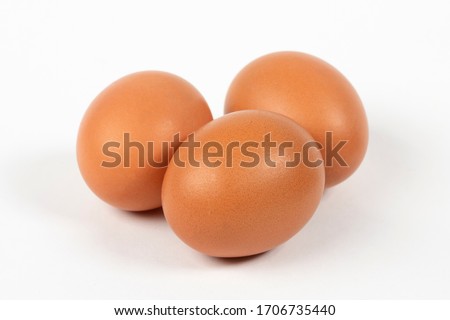Fresh chicken eggs on white background Royalty-Free Stock Photo #1706735440