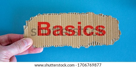 Word Basics on the piece of cardboard between fingers.
