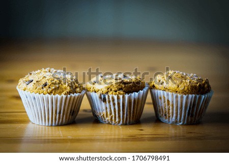 Pumpkin muffins on a wooden table
