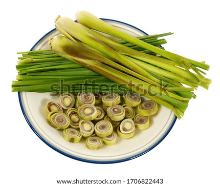 Fresh Lemongrass with slices on plate, top view