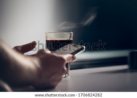 morning coffe, work on smart phone Royalty-Free Stock Photo #1706824282
