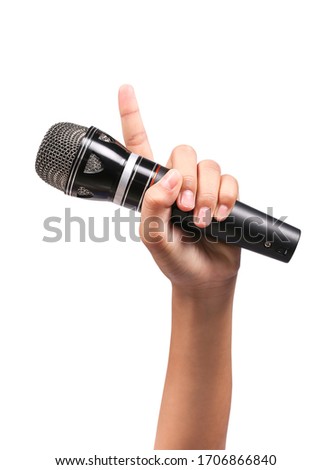 Woman's hand holding a microphone isolated on white background, clipping path