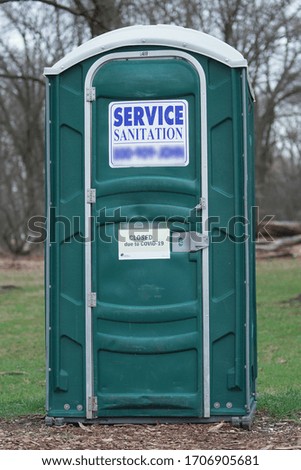           portable     toilet in the park close due corona virus time                