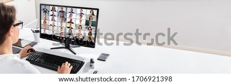 Woman Working From Home Having Online Group Videoconference On Computer
