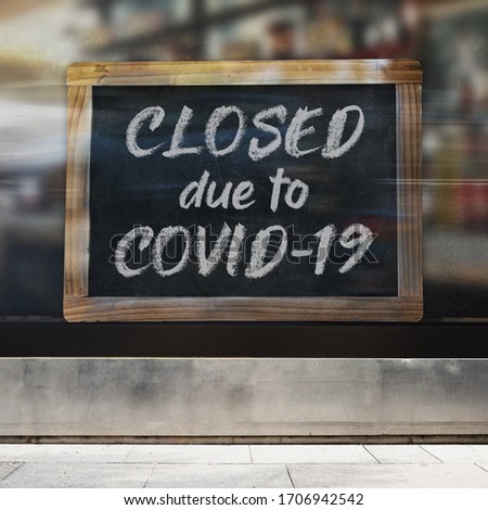 A business sign that says ‘Sorry, We're Closed’ on the window. Royalty-Free Stock Photo #1706942542