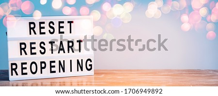 Words reset, restart and reopening on the light box. New life, new business, new deals concept. Royalty-Free Stock Photo #1706949892