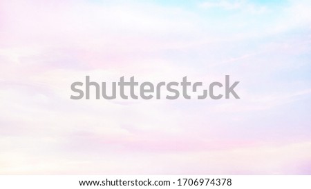 Background of blurred sky and clouds in soft pink tone.