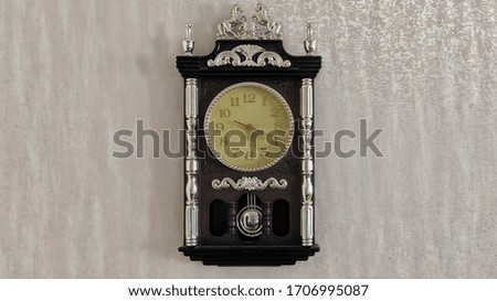Antique clock with a pendulum.