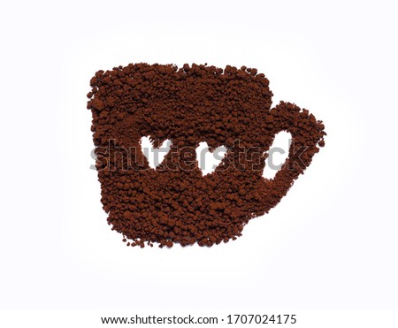 Coffee powder made a cup of coffee and a little two heart shape inside,on white background