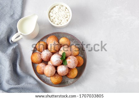 Beautiful breakfast. Cottage cheese donuts  balls  on a light background. Top view. Royalty-Free Stock Photo #1707033805