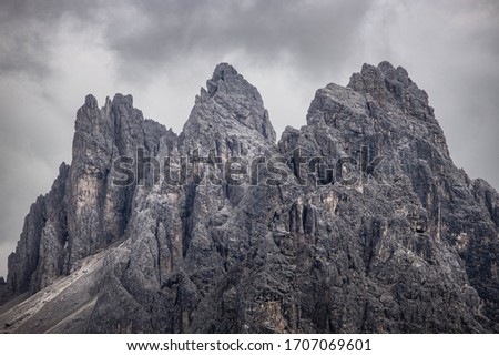 A moody picture of Cadin di Misurina mountains, covered in clouds in bad weather. Cortina d'Ampezzo, Italy.
